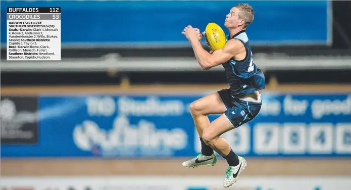  ?? Picture: JUSTIN SANSON ?? Josh Helliwell marking for Darwin during last night’s NTFL premiershi­p clash against Southern Districts at a very wet and slippery TIO Stadium