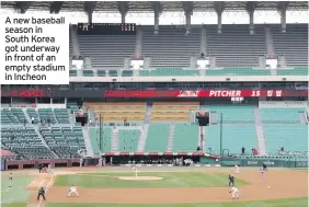  ??  ?? A new baseball season in South Korea got underway in front of an empty stadium in Incheon