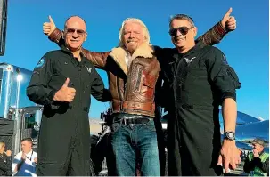  ?? AP ?? Richard Branson, centre, celebrates with pilots Rick Sturckow, left, and Mark Stucky.