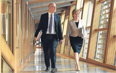  ?? Picture: Ken Jack. ?? Mr Swinney and First Minister Nicola Sturgeon in the Scottish Parliament.