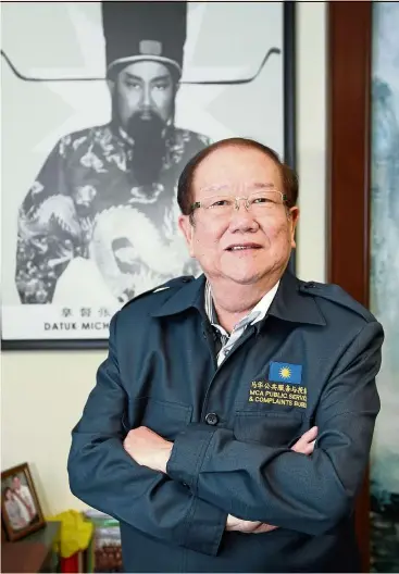  ??  ?? Behind Chong is a picture of himself, much younger then, dressed up as the legendary Bao Zheng (aka Justice Bao), who was a government officer during the Song dynasty. In his 25 years in the civil service, Bao helped countless people, and displayed...