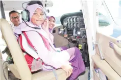  ??  ?? Students onboard the aircraft at the Sabah Flying Club yesterday.