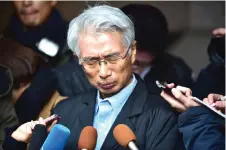  ?? — AFP file photo ?? Hironaka speaks to the media outside his office in Tokyo.