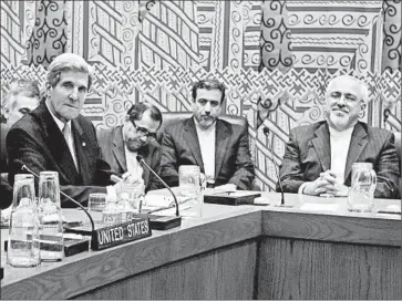  ?? STAN HONDA/ GETTY- AFP PHOTO ?? Secretary of State John Kerry, left, and Iran’s Foreign Minister Mohammad Javad Zarif, right, meet Thursday with officials from five other countries in an attempt to ease the friction between Iran and theWest.