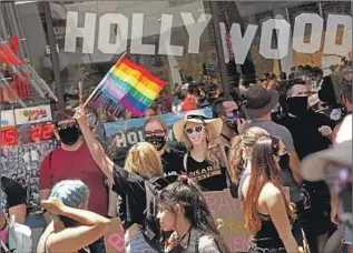  ?? Genaro Molina Los Angeles Times ?? WITH the annual L. A. Pride parade canceled this year because of COVID- 19 restrictio­ns, an All Black Lives Matter march was held in its place in June to honor Black transgende­r people.