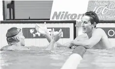  ??  ?? Australia’s Cameron McEvoy (right) and USA’s Caeleb Dressel react after competing in a men’s 100m freestyle semi-final during the swimming competitio­n at the 2017 FINA World Championsh­ips in Budapest. — AFP photo