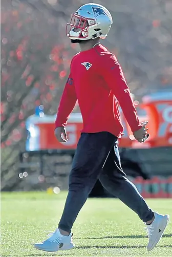  ?? NANCY LANE / BOSTON HERALD ?? TIME FOR A BREATHER: James White, who has had a heavy workland in the Patriots backfield this season, walks through practice yesterday at Gillette Stadium.