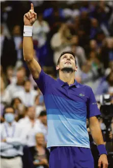  ?? Sarah Stier / Getty Images ?? Novak Djokovic looks to complete a calendar Grand Slam and move ahead of Roger Federer and Rafael Nadal on Sunday.