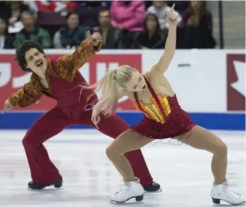  ?? NATHAN DENETTE /THE CANADIAN PRESS ?? Piper Gilles and Paul Poirier say competing alongside Tessa Virtue and Scott Moir motivates them to succeed.