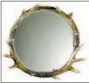  ?? LAMPS PLUS/UTTERMOST VIA AP ?? A mirror designed by Carolyn Kinder for Uttermost, and available at Lamps Plus. The mirror is framed with acrylic stag horns. Elements like these add drama and interest to any room style, and don’t overtly reference the holidays.