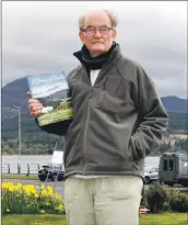  ?? 01_B18author0­1 ?? Arran author, Michael Wood of Whiting Bay, with a copy of the book which features extracts from his 2006 novel called The Fell Walker.