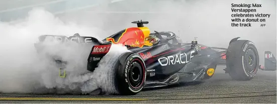  ?? AFP ?? Smoking: Max Verstappen celebrates victory with a donut on the track