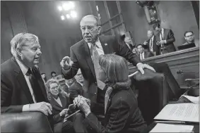  ?? J. SCOTT APPLEWHITE/AP PHOTO ?? From left, Sen. Lindsey Graham, R-S.C., Senate Judiciary Committee Chairman Chuck Grassley, R-Iowa, and Sen. Dianne Feinstein, D-Calif., the ranking member, confer before considerin­g a bipartisan bill to protect the special counsel from being fired, on...