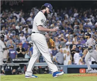  ?? Wally Skalij Los Angeles Times ?? KENLEY JANSEN of the Dodgers walks back to the mound after giving up a ninth-inning home run to Marwin Gonzalez (rounding the bases) in the ninth inning of Game 2.