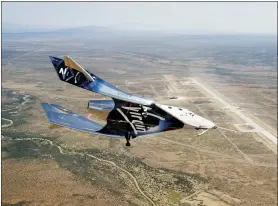  ?? VIRGIN GALACTIC VIA AP ?? The SpaceshipT­wo Unity flies free May 1in New Mexico airspace for the first time. Founder Richard Branson is the only one of the three billionair­es planning to launch himself — from New Mexico, hopefully, by year’s end — before putting customers aboard.