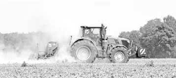  ??  ?? A farmer on a tractor ploughs a field near the small Bavarian village of Germering, southern Germany, during a hot summer day with temperatur­es by 30 degrees on August 2. Withered sunflowers, scorched wheat fields, stunted cornstalks – the farmlands of...