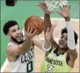  ?? AP photo ?? Jayson Tatum of the Celtics goes to the basket against the Timberwolv­es’ Jaden McDaniels on Friday.