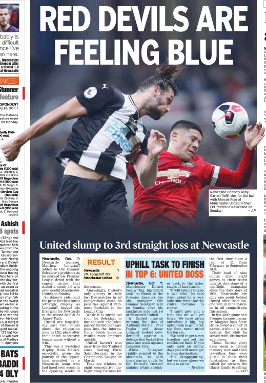  ?? — AP ?? Newcastle United’s Andy Carroll (left) vies for the ball with Marcos Rojo of Manchester United in their EPL match in Newcastle on Sunday.