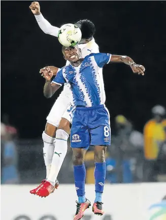  ?? Picture: ANESH DEBIKY/GALLO IMAGES ?? HEAD TO HEAD: Siphesihle Ndlovu of Maritzburg United and Motjeka Maisha of Mamelodi Sundowns in action during their Absa Premiershi­p match in Durban last night