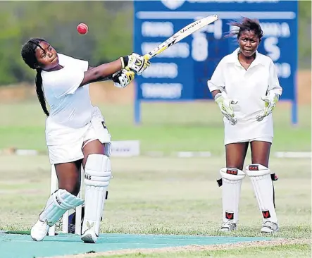  ?? Pictures: SIBONGILE NGALWA ?? TOP SHOT: Mihlali Njiva wields her bat while Lithemba Mfuko looks on at the Momentum Friendship Games