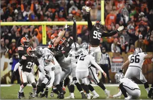  ?? DAVID RICHARD — THE ASSOCIATED PRESS ?? Las Vegas Raiders kicker Daniel Carlson (2) boots a winning 48-yard field goal during the second half of an NFL football game against the Cleveland Browns, Monday in Cleveland.