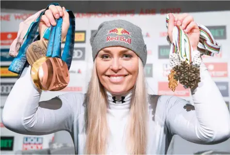  ?? — AFP ?? US Lindsey Vonn poses with her medals following a press conference after the Women’s Downhill event of the 2019 FIS Alpine Ski World Championsh­ips at the National Arena in Are, Sweden, on Sunday.