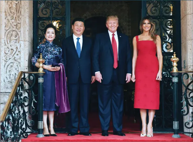  ?? Photo: Xinhua ?? Chinese President Xi Jinping and his wife Peng Liyuan pose for a photo with US President Donald Trump and his wife Melania Trump at Mar-a-Lago, Florida on Friday.