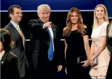  ??  ?? Donald Trump with son Donald Jnr (left), wife Melania, and daughter Ivanka (right).