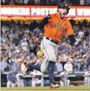  ?? Wally Skalij Los Angeles Times ?? GEORGE SPRINGER reacts after hitting a two-run home run in Game 7. His record-tying fifth homer of the World Series helped secure the MVP award.
