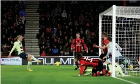  ?? Photograph: Bryn Lennon/Getty Images ?? Erling Haaland scores Manchester City’s second goal against Bournemout­h.