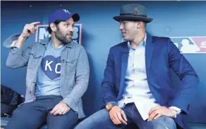  ?? CHRISTIAN PETERSEN,
GETTY IMAGES ?? Carlos Correa, right, with actor Paul Rudd at the 2015 World Series, wears a different fedora for each road trip.