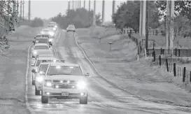  ?? Edward A. Ornelas / San Antonio Express-News ?? There was a long funeral procession Saturday for the Rodrigueze­s, two of 26 who were killed in a mass shooting inside Sutherland Springs First Baptist Church.