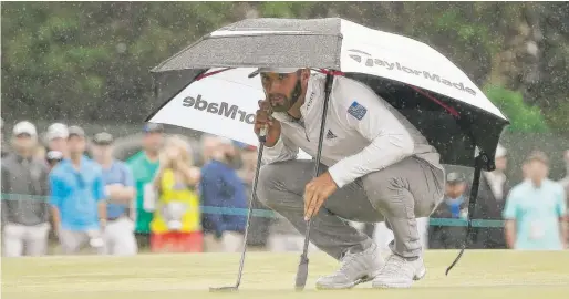  ?? AP ?? Dustin Johnson, seeking his second U. S. Open title in three years, endured the wind and two hours of rain to shoot a 3- under 67 on Friday at Shinnecock Hills.