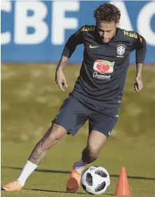  ?? AP PHOTO ?? GLAD TO HAVE YOU BACK: Neymar, in his first action since having surgery on his right foot, controls the ball during a practice session for the Brazilian national team yesterday in Teresopoli­s, Brazil.