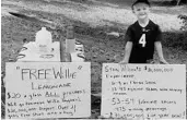  ?? DANIEL J. GRANT ?? FSU fan Grayton Grant, 4, set up a lemonade stand with the help of his father to help fund embattled Seminoles coach Willie Taggart’s buyout.