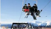  ?? ALEJANDRA BARTOLICHE Bloomberg News ?? Tourists flock to Argentina’s Cerro Catedral ski resort to take advantage of cheaper flights, meals and chair lifts.