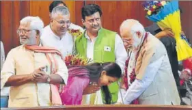  ?? PTI ?? Prime Minister Narendra Modi is greeted by BJP MP Pritam Munde at a function organised in Parliament house on Wednesday to thank him for the passage of OBC bill in Lok Sabha.