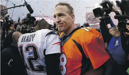  ?? EZRA SHAW / GETTY IMAGES ?? New England Patriots quarterbac­k Tom Brady, left, congratula­tes Denver Broncos quarterbac­k Peyton
Manning following Sunday’s AFC Championsh­ip Game in Denver. The Broncos were 20-18 winners.