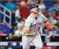  ?? Lynne Sladky / Associated Press ?? The Mets’ Pete Alonso watches after hitting a solo home run during the second inning against the Marlins on Saturday.