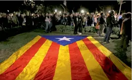  ??  ?? Demonstrat­ors gather outside the Catalonian Parliament to protest against the decision of a judge to jail ex-members of Catalonia, in Barcelona on Friday.