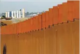  ??  ?? JORGE DUENES/REUTERS The prototypes for US President Donald Trump’s border wall are seen behind the border fence between Mexico and the United States, in Tijuana, Mexico January 7, 2019.