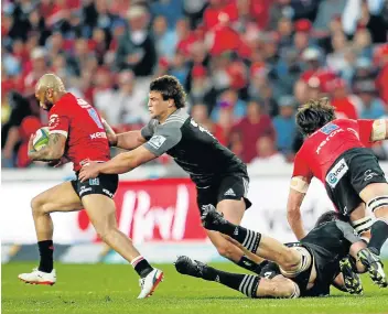  ?? Picture: REUTERS ?? SETTING AN EXAMPLE: The Lions' Lionel Mapoe, seen here being challenged by the Crusaders’ Ben Funnell at Ellis Park last year, will hope to inspire his teammates to victory in their Super Rugby semifinal clash against the Waratahs on Saturday.
