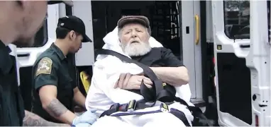  ?? ABC VIA THE ASSOCIATED PRESS ?? Jakiw Palij, a former Nazi concentrat­ion camp guard, is carried on a stretcher from his home in New York into a waiting ambulance on Monday.