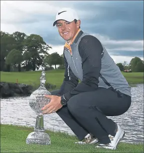  ??  ?? PRIZE GUY: Rory McIlroy proudly shows off the Irish Open trophy at The K Club