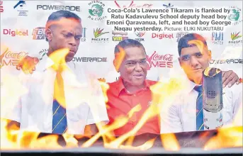  ?? Picture: ELIKI NUKUTABU ?? Coca-Cola’s Lawrence Tikaram is flanked by Ratu Kadavulevu School deputy head boy Emoni Qaravanua, left, and head boy George Naqau yesterday.