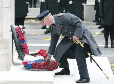  ?? WENN.COM ?? Prince Charles lays a wreath Saturday at the cenotaph at the annual Remembranc­e Day ceremony in London.