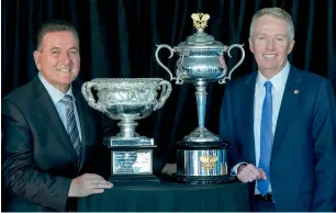  ?? AFP ?? Victorian state minister for sport and major events John Eren (left) and Australian Open Tournament director Craig Tiley pose with the Australian Open trophies at the launch in Melbourne. —