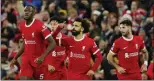  ?? JON SUPER — THE ASSOCIATED PRESS ?? Liverpool’s Mohamed Salah celebrates after scoring his side’s opening goal during the English Premier League match against Arsenal in Liverpool, England on Saturday.
