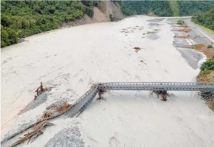  ?? Photo / File ?? The Waiho River Bridge between Fox Glacier and Franz Josef Glacier was washed out amid heavy rains this year.