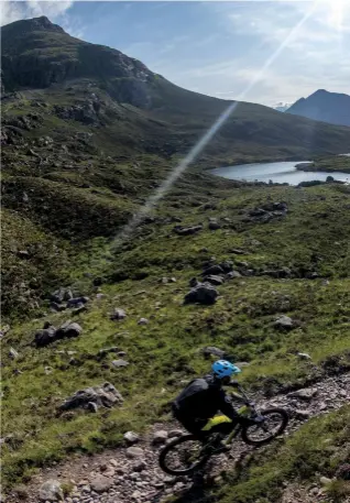  ??  ?? Right Craig and Dave lead the way over the Bealach na Lice, past Loch an Eoin